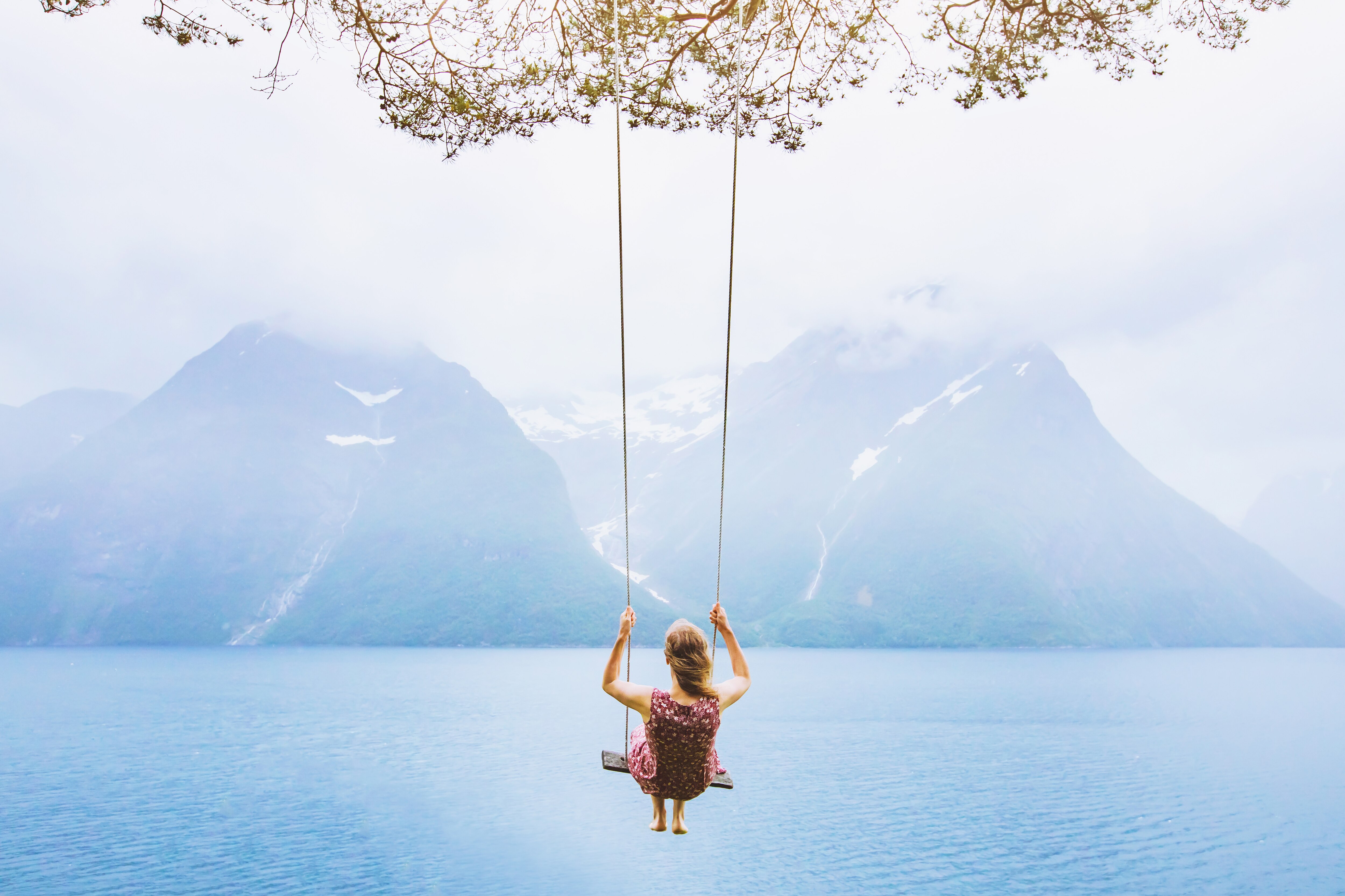 Woman on a swing in the nature
