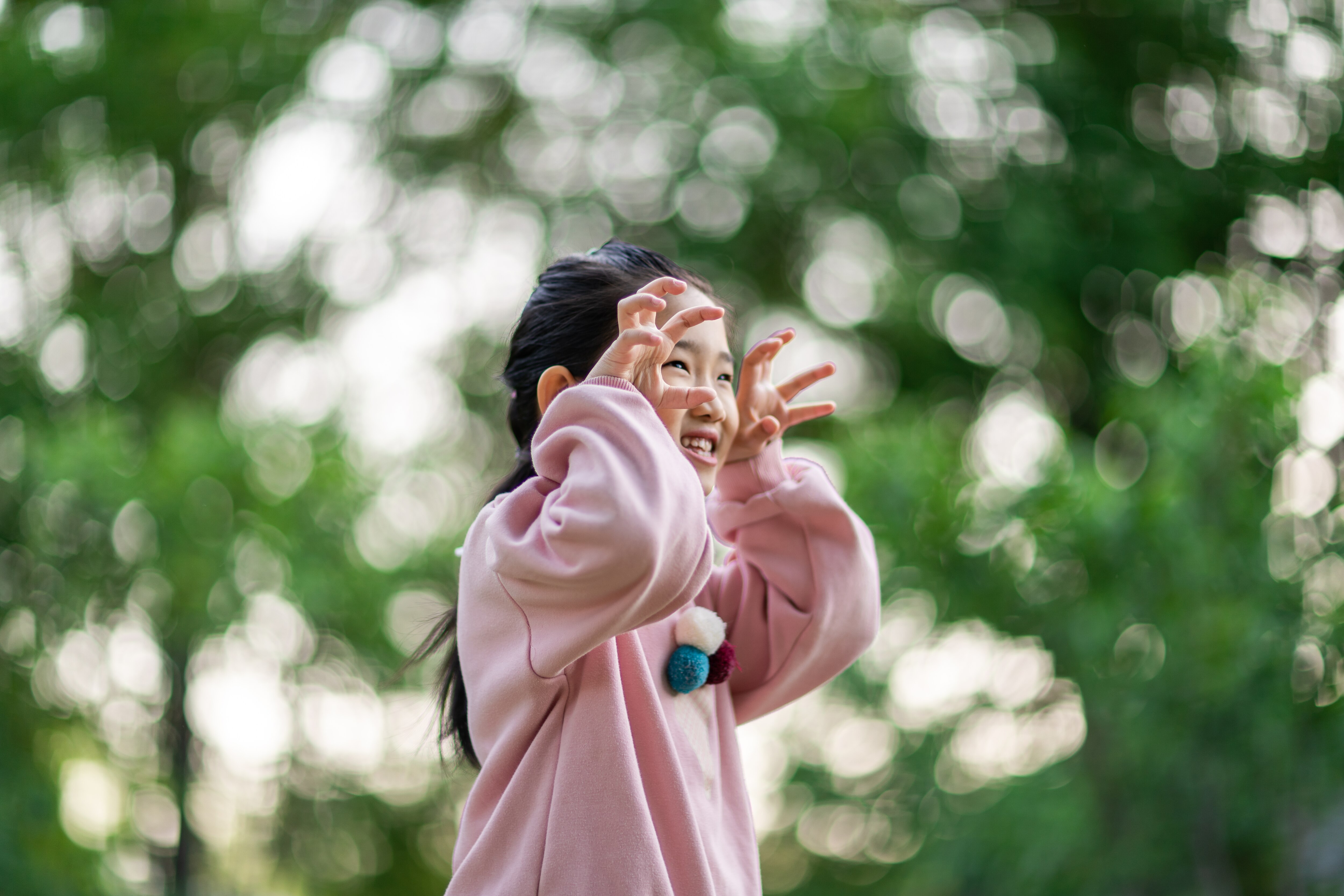 girl making scary movements with her hands