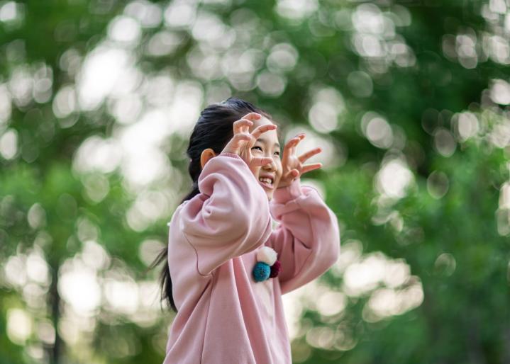 girl making scary movements with her hands